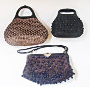 Large quantity of assorted leather and other handbags, to include clutch bags etc., in wicker