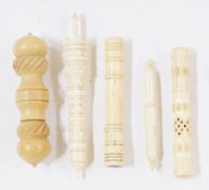 Four pierced and carved decorated bone, one vegetable ivory and other needlecases