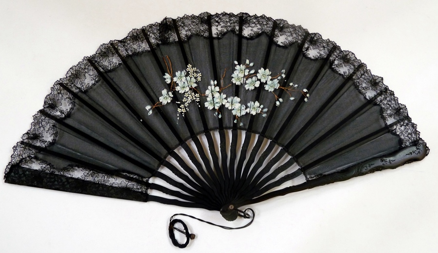 Small black wood and net fan, decorated with silver sparkles, another larger black wood floral