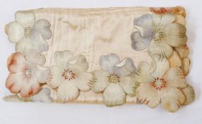A 19th century table runner, embroidered satin with peonies, in various muted colours with scalloped