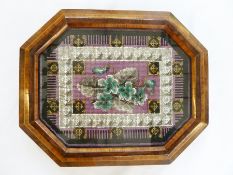 A wood framed Berlin beadwork stand, octagonal wood frame with inlay and four bun feet, 23 x 29cm