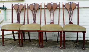 Set of four Edwardian mahogany dining chairs, distinctive design with pierced splats, upholstered