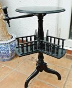 Edwardian ebonised circular book table, having spindle galleried revolving mid-tier, candle sconces,