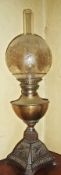 Victorian brass and iron oil lamp, with etched globular shade