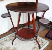 Edwardian circular mahogany two-tier occasional table, the tripod turned supports with swivel