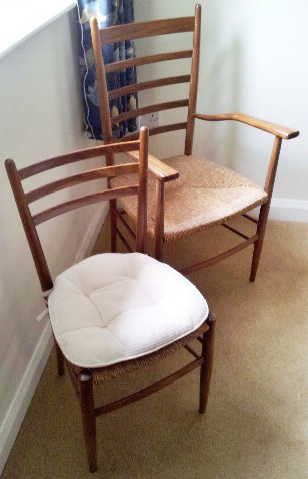 Set of six 1960s continental rosewood or teak rush seated dining chairs, viz:- pair carvers open