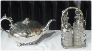 Silverplate teapot of compressed bullet form, pomegranate finial, scroll handle and engraving, James