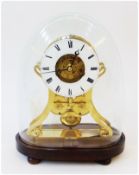 Nineteenth century brass skeleton clock with enamel chapter ring, striking movement, on wooden