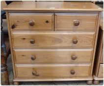Modern pine chest of two short and three long drawers on bun feet, 84cm wide
