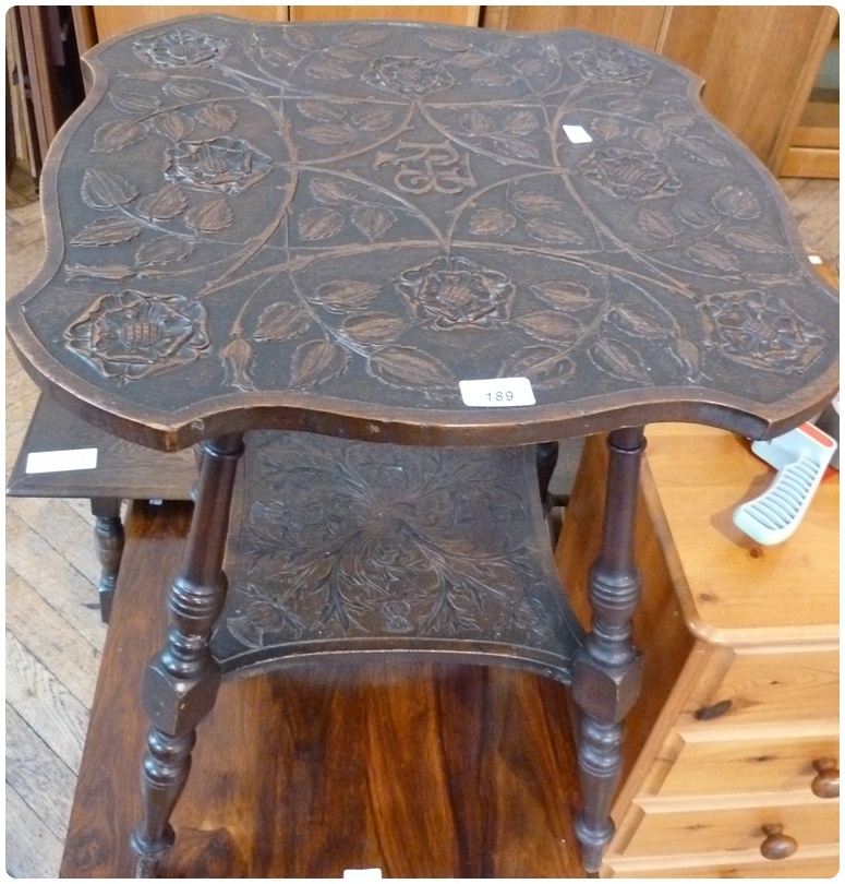 Modern carved oak two-tier occasional table, the top carved with English rose and initialled "