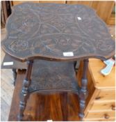Modern carved oak two-tier occasional table, the top carved with English rose and initialled "