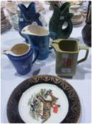 Wade "Gilbey's" Dry Gin jug, Wade Whitehorse whisky jug, two Devon pottery guggle jugs, Wade J & B