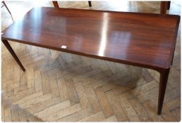 1970s Danish rosewood coffee table, rectangular with circular tapering supports, 150cm wide