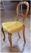 Six Victorian matched walnut balloonback dining chairs, each with carved pierced scroll crossrail,