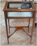 Edwardian inlaid mahogany bijouterie table, top all cross banded, glazed top and sides, raised