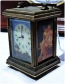 An early 20th century miniature carriage clock timepiece with carry handle