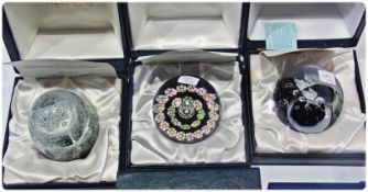 Three Caithness paperweights, to include "Cascade", designed by Peter Holmes, cased with