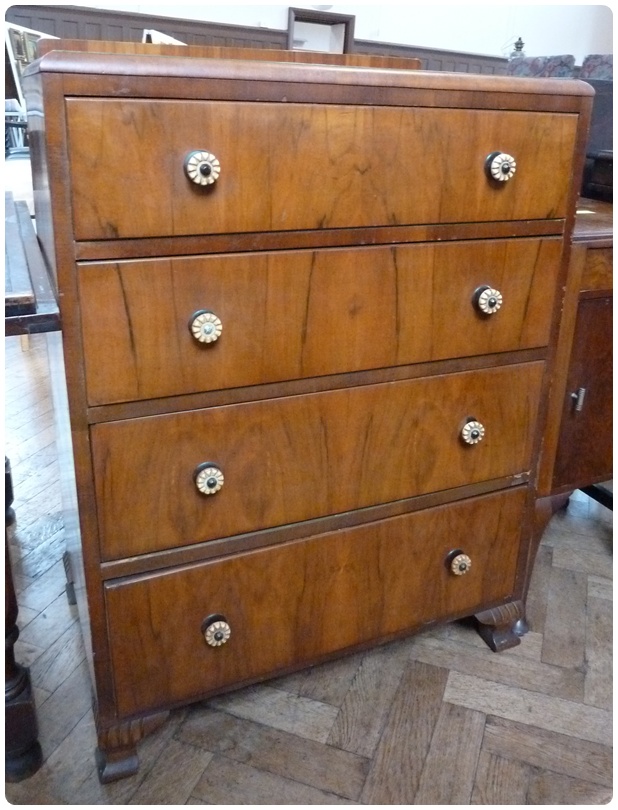 Modern walnut veneered chest of four long drawers, with circular handles, on bracket feet, 74cm