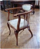 Late Victorian/Edwardian curved open armchair, with padded oval shoulderboard, shaped upright and