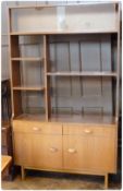 Twentieth century display unit, with glass-fronted shelf and two other shelves below, on cupboard