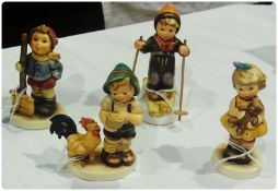 Four Goebel Hummel figures, "Morning Call", "Skier", "Cuddles" and "Let It Snow", all boxed (4)