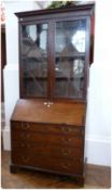 Georgian mahogany bureau bookcase, the top with dentil and cavetto cornice, fitted three shelves