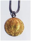 George III gold guinea coin pendant, 1775, on white metal chain