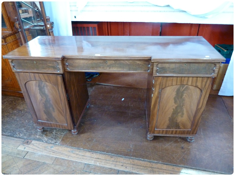 Victorian mahogany pedestal sideboard, the break front with three frieze drawers, the pair of arched