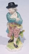 18th century Derby porcelain figure of gentleman with crossed arms, 16cm high (bearing label from