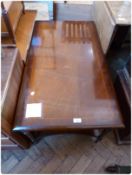 A reproduction mahogany rectangular top coffee table, on turned tapering legs, with undershelf,