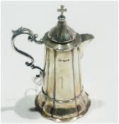 George V silver small communion jug and cover, with C-scroll handle, of tapering cylindrical form,