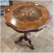 A modern inlaid tripod table, with wavy edge top, and floral inlay on turned pedestal support with