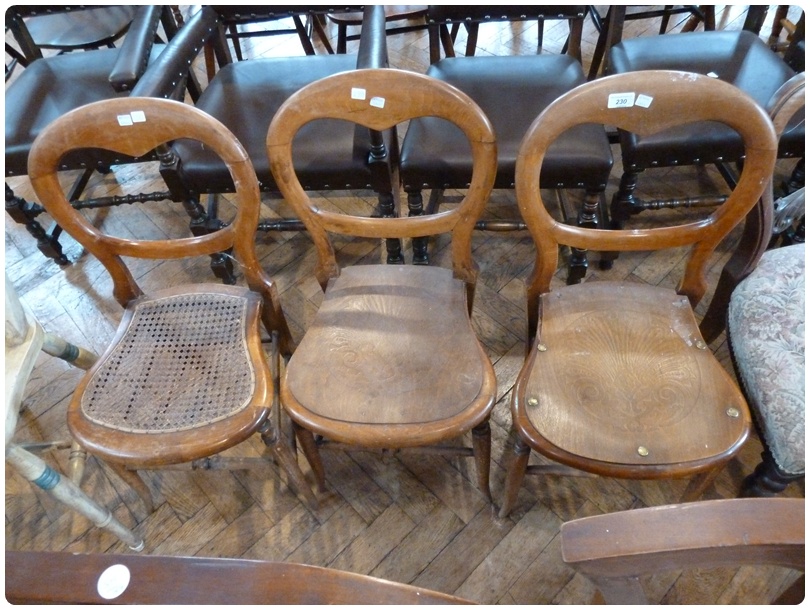 Set of three Victorian balloonback dining chairs, on turned legs united by stretchers (3 singles)