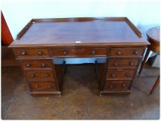 Victorian mahogany pedestal desk, the top with gallery surround, three frieze drawers with three