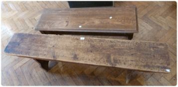 An oak bench with moulded edge top, lunette carved frieze, on carved legs united by stretchers