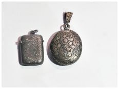 Silver coloured metal locket, possibly Indian together with a silver vesta (2)