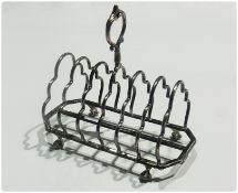 A Victorian silver six-division toastrack, raised on claw and ball feet, Sheffield 1872, 18cm
