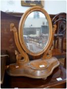 Victorian satinwood oval swing frame mirror, with trinket box to base, on turned legs, width 50cm