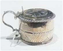 A Georgian silver circular mustard pot with foliate pattern hinged cover and scroll handle, by