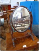 Georgian style oval swing-frame dressing table mirror, on splayed supports with central stretcher,