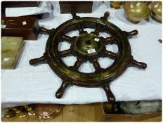 Wooden ship's wheel, with brass fittings