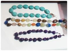 Three polished stone necklaces, amethyst, quartz and turquoise