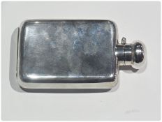 A George V silver hip flask, of plain form, with hinged knop top with bayonet fitting, Chester 1923,