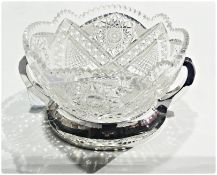 A heavy cut glass circular continental bowl, on a twin-handled foreign silver stand, 26cm