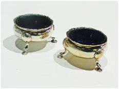 Pair Georgian circular open salts, with reeded borders, on cabriole legs and pad feet, blue glass