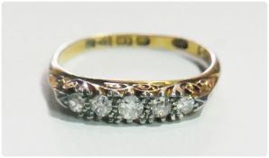 18ct gold and five-stone diamond ring, set five graduated old-cut stones in scroll pierced setting