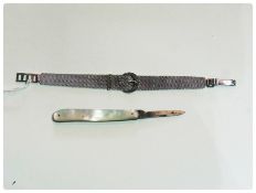 White metal and marcasite buckle pattern bracelet and mother-of-pearl handled fruit knife (2)