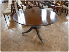 Reproduction mahogany circular top dining table, with reeded edge, on turned pedestal with three