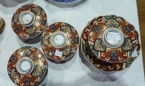 Set of four oriental rice/soup bowls with matching side plates, cream ground with red, blue and gilt