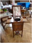 George III mahogany gentleman's washstand, the top opening a reveal rising mirror, with receptacle